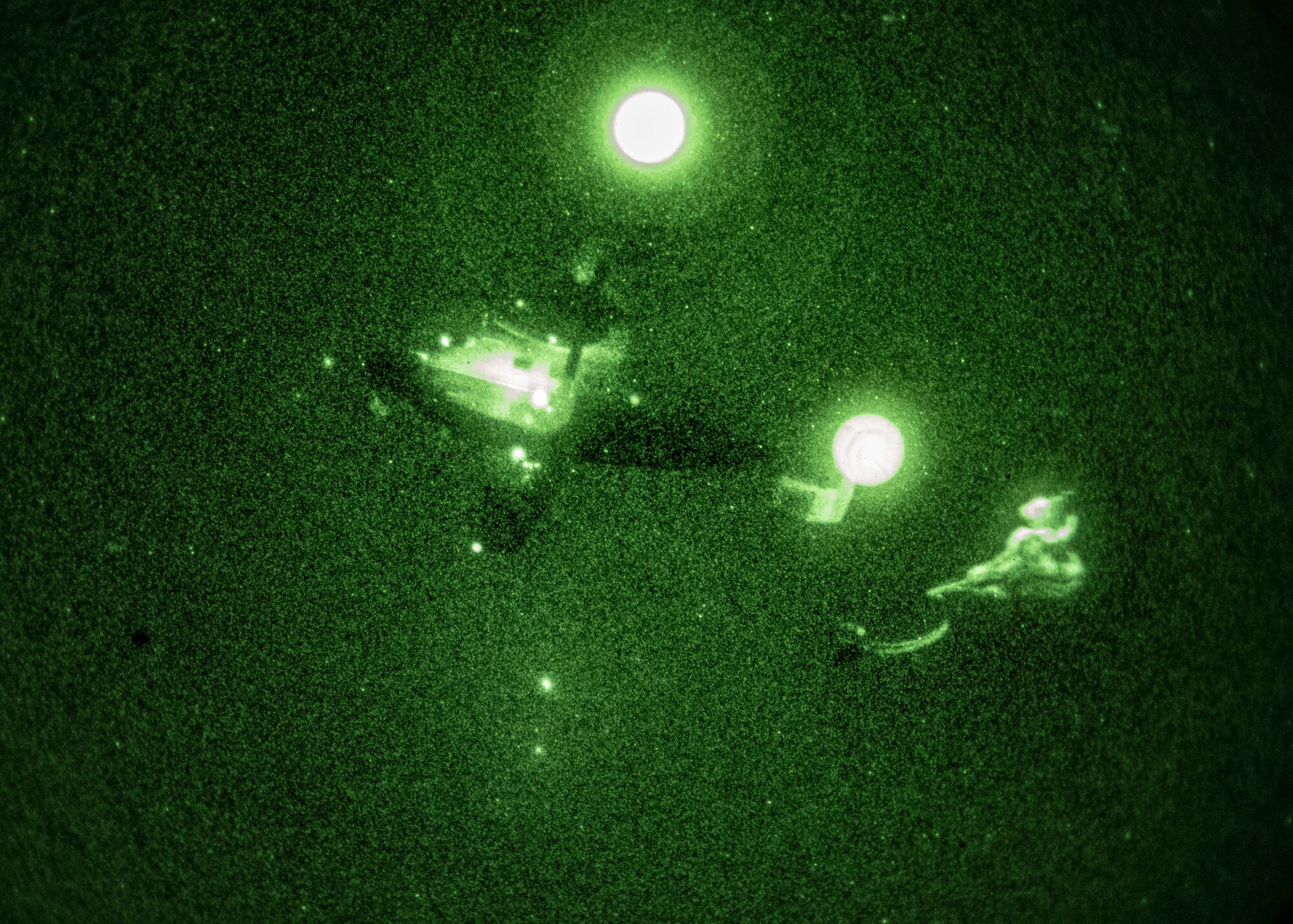 A C-145A Skytruck drops a hand-toss bag rigged to a parachute as part of an aerial delivery training exercise on the Eglin Range, Florida on Jan. 6, 2021.