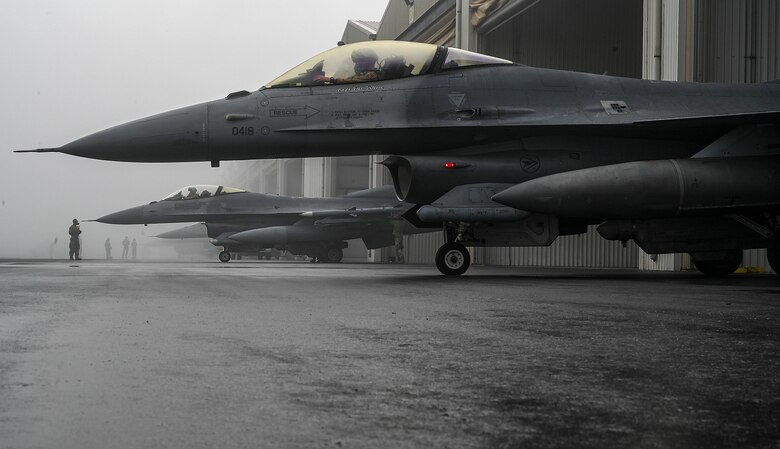 U.S Air Force F-16 Fighting Falcons assigned to the 480th Expeditionary Fighter Squadron (EFS) prepare to taxi at Al Dhafra Air Base, United Arab Emirates, Jan. 19, 2021.