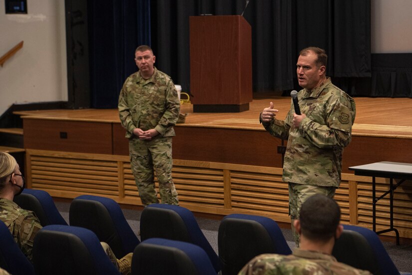 Photo of an Airman speaking during a squadron leadership meeting.