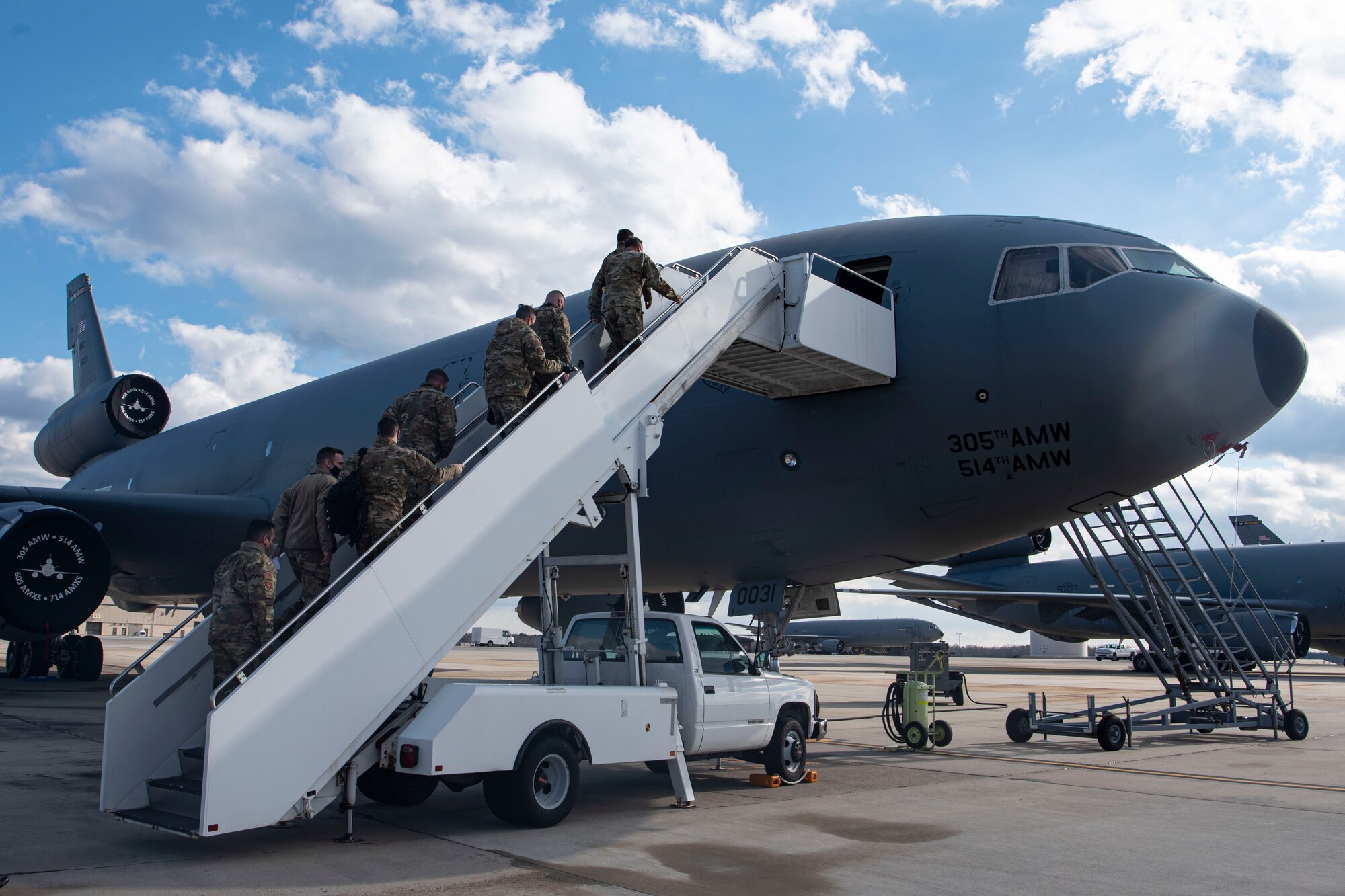 Photo of Airman walking toward a KC-10 Extender.