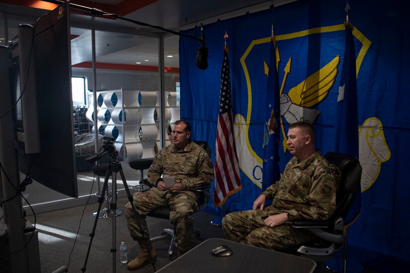 Photo of Airmen hosting a virtual all call.
