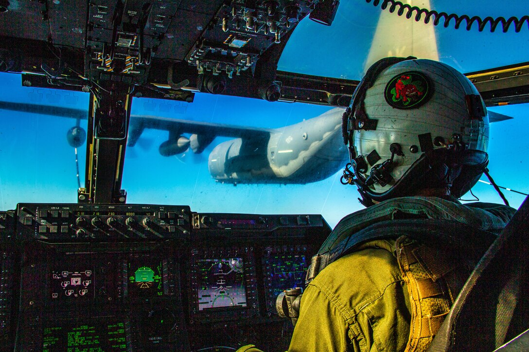 A U.S. Marine prepares his MV-22B Osprey for a tiltrotor air-to-air refueling exercise over the Hawaiian Islands, Jan. 14.