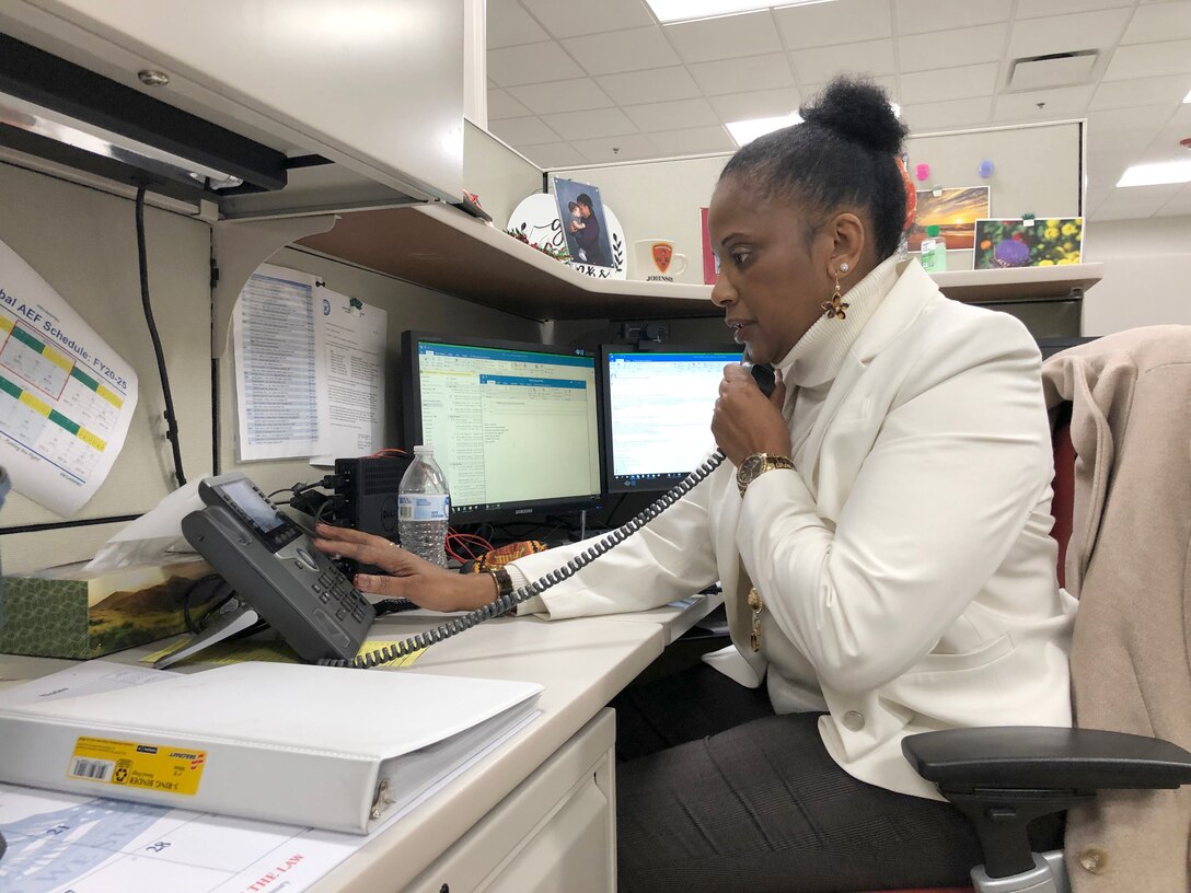 Audrey Delaney, a deployment readiness planning specialist assigned to the Aviation Branch, coordinates sourcing solutions for an upcoming deployment.