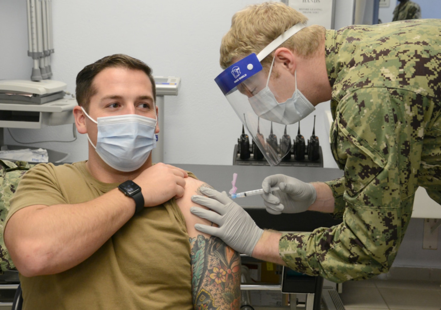 210111-N-AZ866-0130 NAVAL SUPPORT ACTIVITY SOUDA BAY, Greece (Jan. 11, 2021)

Hospital Corpsman 3rd Class Zak McBride receives the Moderna COVID-19 vaccine from Hospital Corpsman 3rd Class Caleb Newbill at the Branch Health Clinic Souda Bay, Jan. 11, 2021. The vaccine is being administered in phases based on DoD priority levels to reduce the burden of COVID-19 in high-risk populations and simultaneously mitigate risk to military operations. McBride a native of Ellington, Conn. Newbill is a native of Covington, Tenn. NSA Souda Bay is an operational ashore base that enables U.S., allied, and partner nation forces to be where they are needed when they are needed to ensure security and stability in Europe, Africa, and Southwest Asia. (U.S. Navy photo by Mass Communication Specialist 2nd Class Kelly M. Agee/Released)
