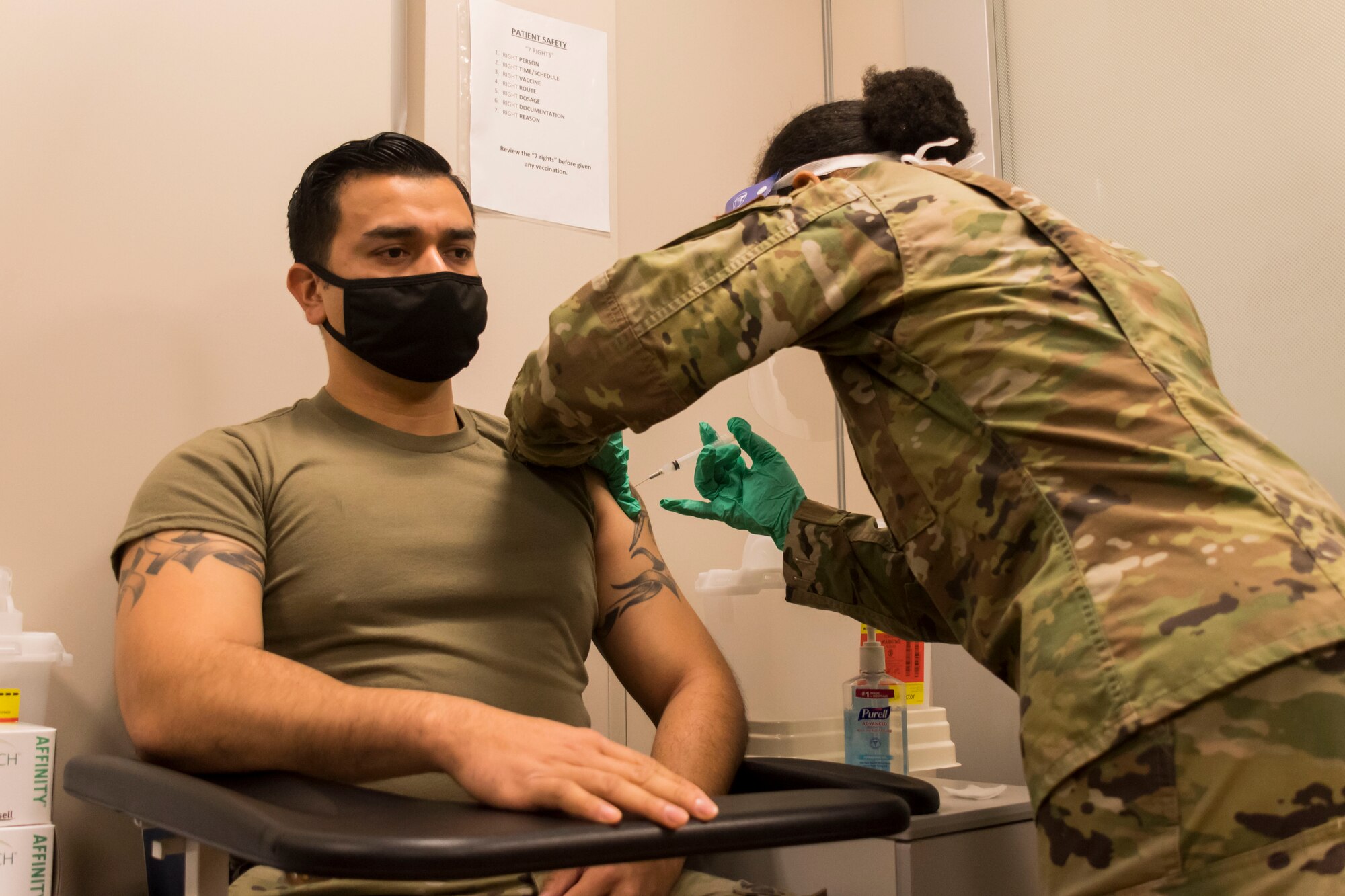 Staff Sgt. Norman Diaz, 94th Security Forces Squadron patrolman, receives the COVID-19 vaccination at Dobbins Air Reserve Base, Ga. on Jan. 22, 2020. Also in the first wave of vaccinations were firefighters and other security forces Airmen from Dobbins. (U.S. Air Force photo/Andrew Park)