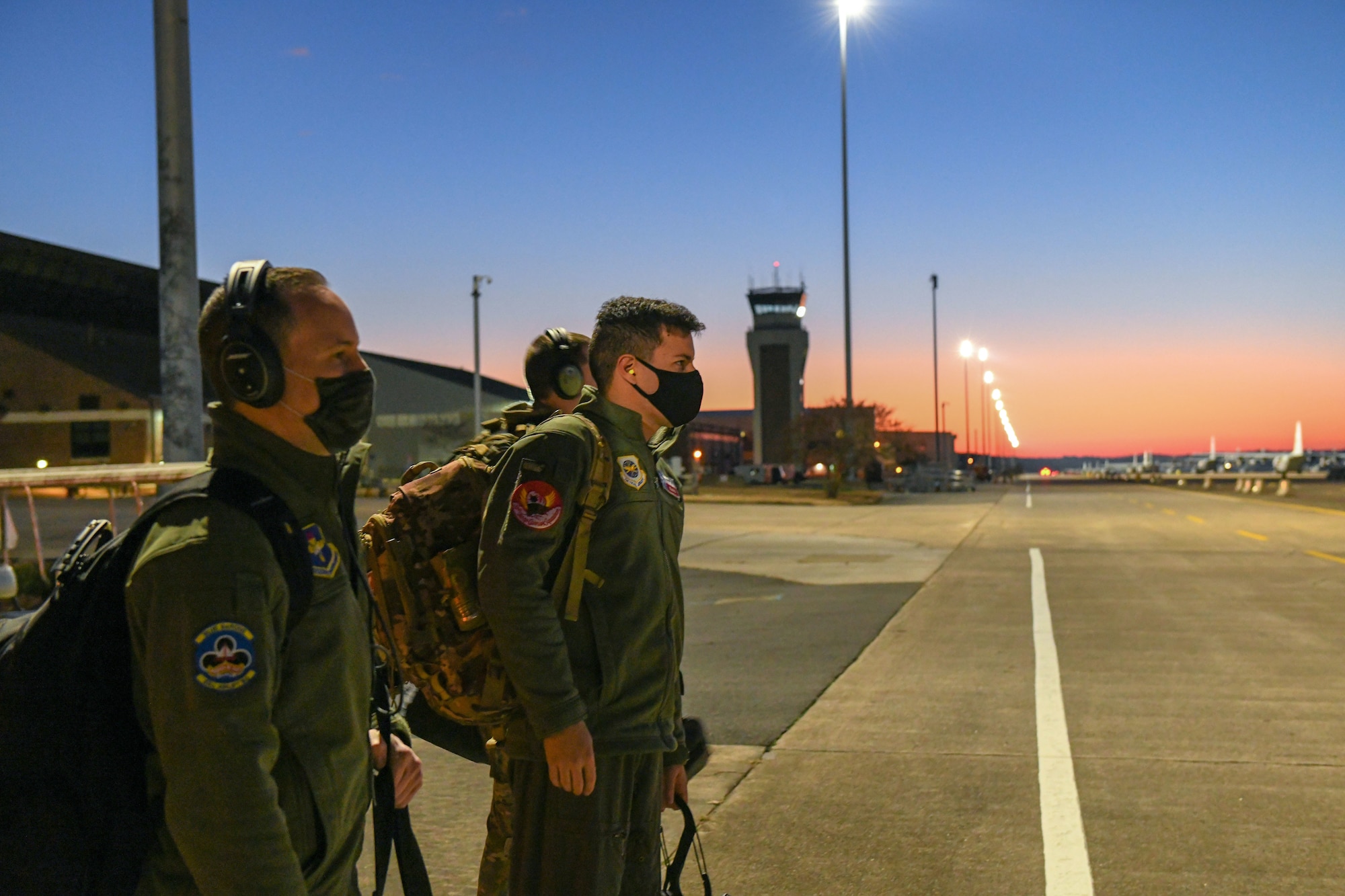 A group of people ready to board an aircraft