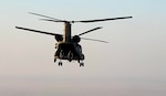 A CH-47 Chinook helicopter, operated by Soldiers with Bravo Company, 3-238th General Support Aviation Battalion, 28th Expeditionary Combat Aviation Brigade, flies over the 28th ECAB's area of operations in the Middle East during a routine flight mission. Soldiers with the 28th ECAB recently passed the midway point of their deployment.