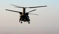 A CH-47 Chinook helicopter, operated by Soldiers with Bravo Company, 3-238th General Support Aviation Battalion, 28th Expeditionary Combat Aviation Brigade, flies over the 28th ECAB's area of operations in the Middle East during a routine flight mission. Soldiers with the 28th ECAB recently passed the midway point of their deployment.