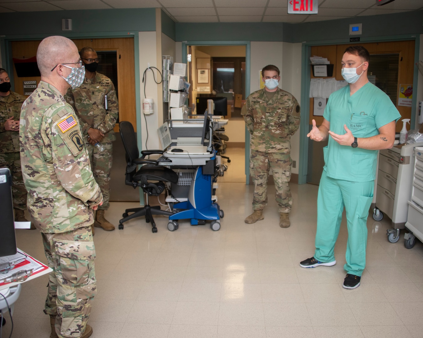 Army Lt. Gen. Ronald Place, Director, Defense Health Agency, talks with Spc. Aaron Neuenschwander, health care specialist, at Brooke Army Medical Center, Fort Sam Houston, Texas, Jan. 20, 2021.