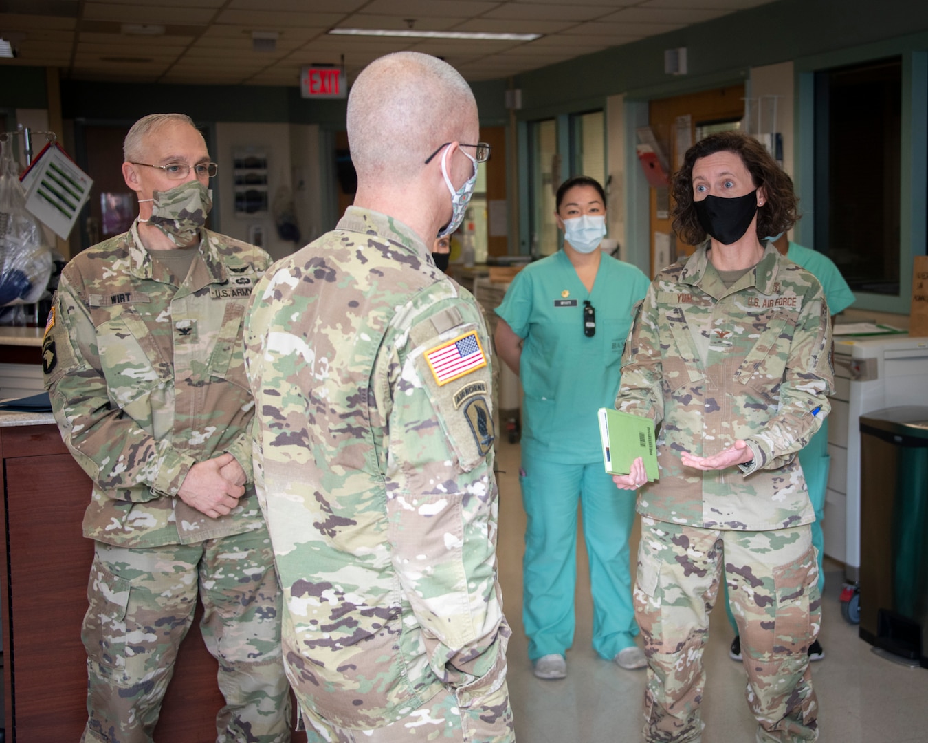 Air Force Col. Heather Yun, Deputy Commander for Medical Services, talks to Army Lt. Gen. Ronald Place, Director, Defense Health Agency, at Brooke Army Medical Center, Fort Sam Houston, Texas, Jan. 20, 2021.