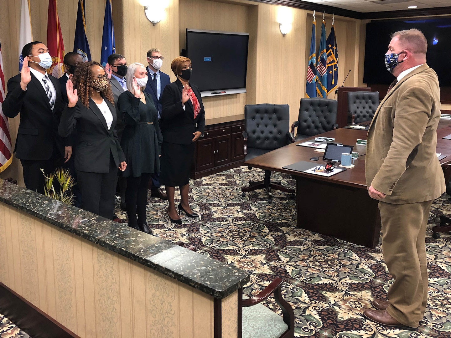 DLA Disposition Services Director Mike Cannon swears in new Pathways to Career Excellence Program participants at a Jan. 7 Oath of Office event. Shown taking the oath in the front row are, from left to right, Sabrina Young, Danielle Woods, and Margarietta Glass. In the back row are Jeremiah Burns, Michael Vaughn, Ryan Riedel, and Brandon Awkerman.