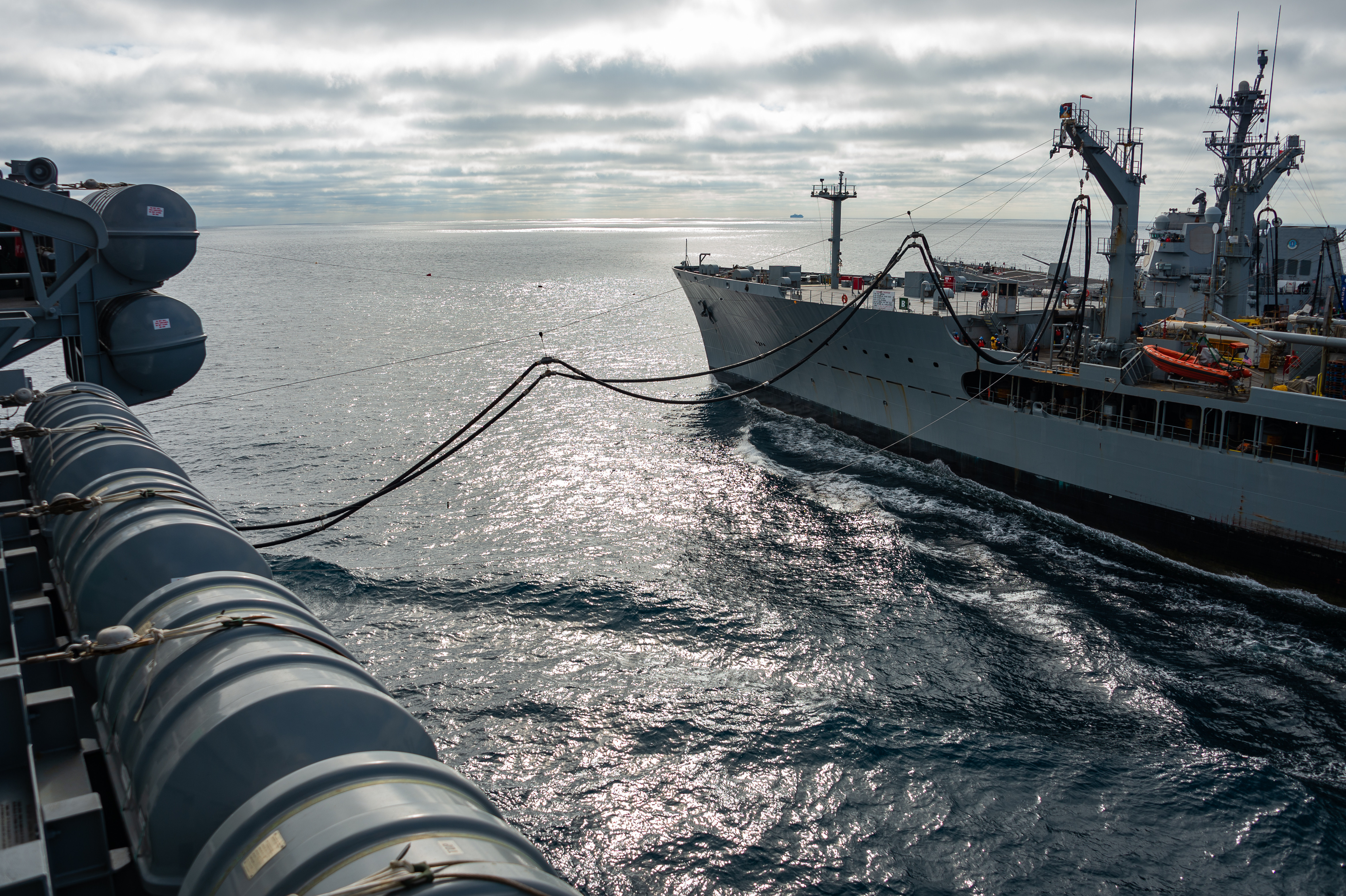 Nimitz-class aircraft carrier USS Carl Vinson (CVN 70) conducts a replenishment-at-sea with Henry J. Kaiser-class fleet replenishment oiler USNS John Lenthall (T-AO 189).