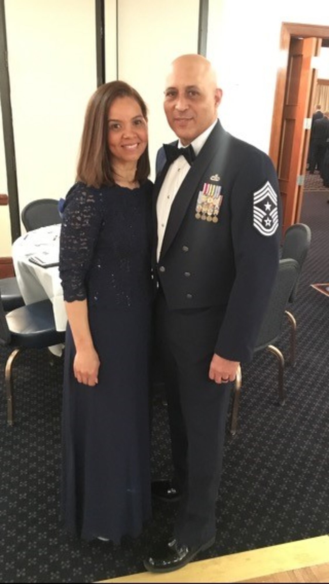 Chief Master Sgt. Jose Velez, Jr., former 459th Air Refueling Wing Command Chief, poses for a photo with his wife Ivelisse, during an awards banquet January 2019. Velez will complete 26 years of military service on Feb. 28, 2021. (Courtesy Photo)