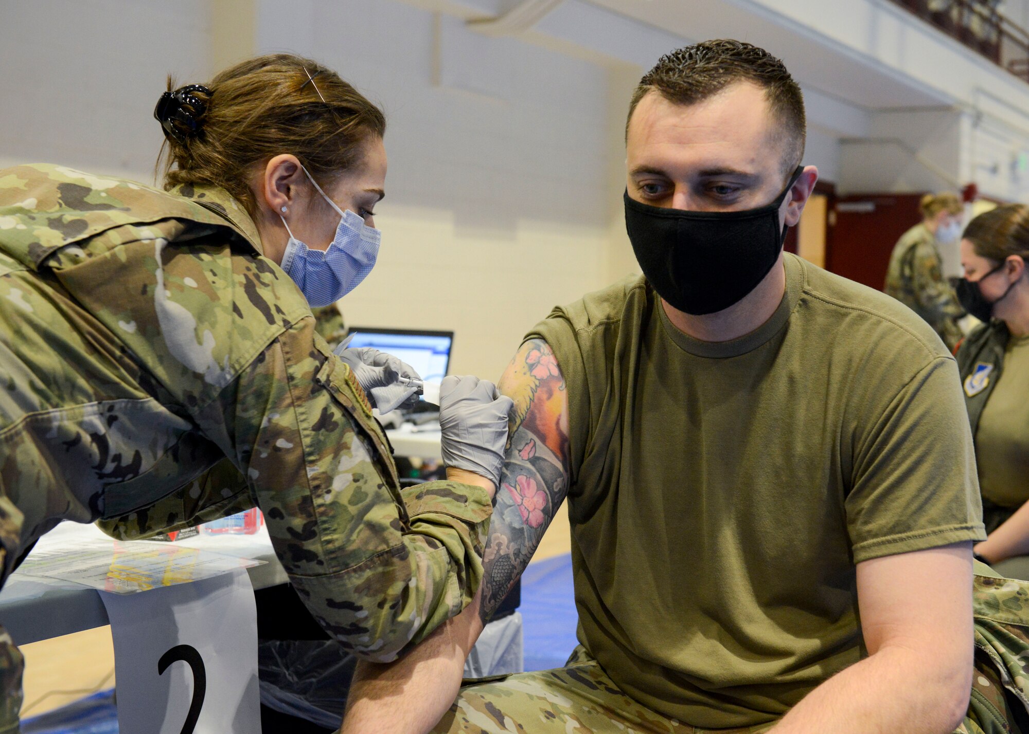 Tech. Sgt. Jerry Dye receives a COVID-19 vaccination at Joint Base Elmendorf-Richardson Jan. 14, 2020. Dye was motivated to get the vaccine after his 6-year-old son nearly died of complications of the disease.