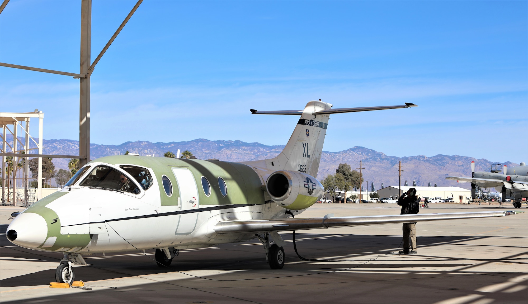 Chad Ellingson, 576th Aerospace Maintenance and Regeneration Squadron, assists the flight crew.