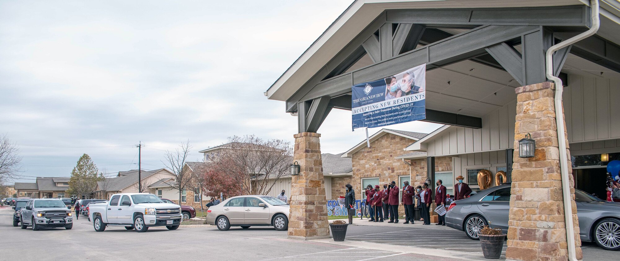 Cars line up for a parade to celebrate the 100th birthday of retired Master Sgt. James Bynum, a documented Original Tuskegee Airman, Jan. 9 at the Grandview Assisted Living Facility in San Antonio, Texas. To celebrate the milestone, the Tuskegee Airmen San Antonio Chapter held a drive-thru car parade where close to a 100 cars showed up to wish him a happy birthday.