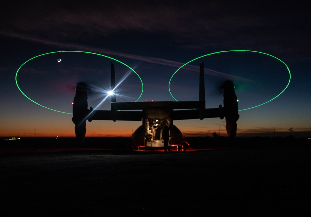 An MV-22 Osprey with Marine Medium Tiltrotor Squadron (VMM) 165 (Reinforced), 11th Marine Expeditionary Unit, stages during a night during a Tactical Recovery of Aircraft and Personnel (TRAP) exercise at Marine Corps Base Camp Pendleton, California, Dec. 16, 2020. The purpose of the exercise was to familiarize the TRAP force with providing immediate response to isolated personnel in potential search and rescue situations, during both day and night scenarios. (U.S. Marine Corps photo by Sgt. Jennessa Davey)