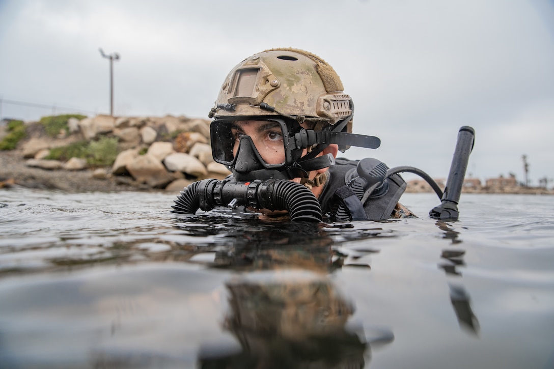 U.S. Marine Corps Cpl. Andre Gordon, a radio telephone operator with the All Domain Reconnaissance Detachment (ADRD), 11th Marine Expeditionary Unit (MEU), prepares to dive during a combatant dive exercise at Marine Corps Base Camp Pendleton, California, Jan. 5, 2020. The ADRD conducted the training to refine and sustain proficiency in combatant dive skills and enhance the capability to conduct specialized insertion and extraction methods in preparation for their upcoming deployment with the 11th MEU. (U.S. Marine Corps photo by Sgt. Jennessa Davey)