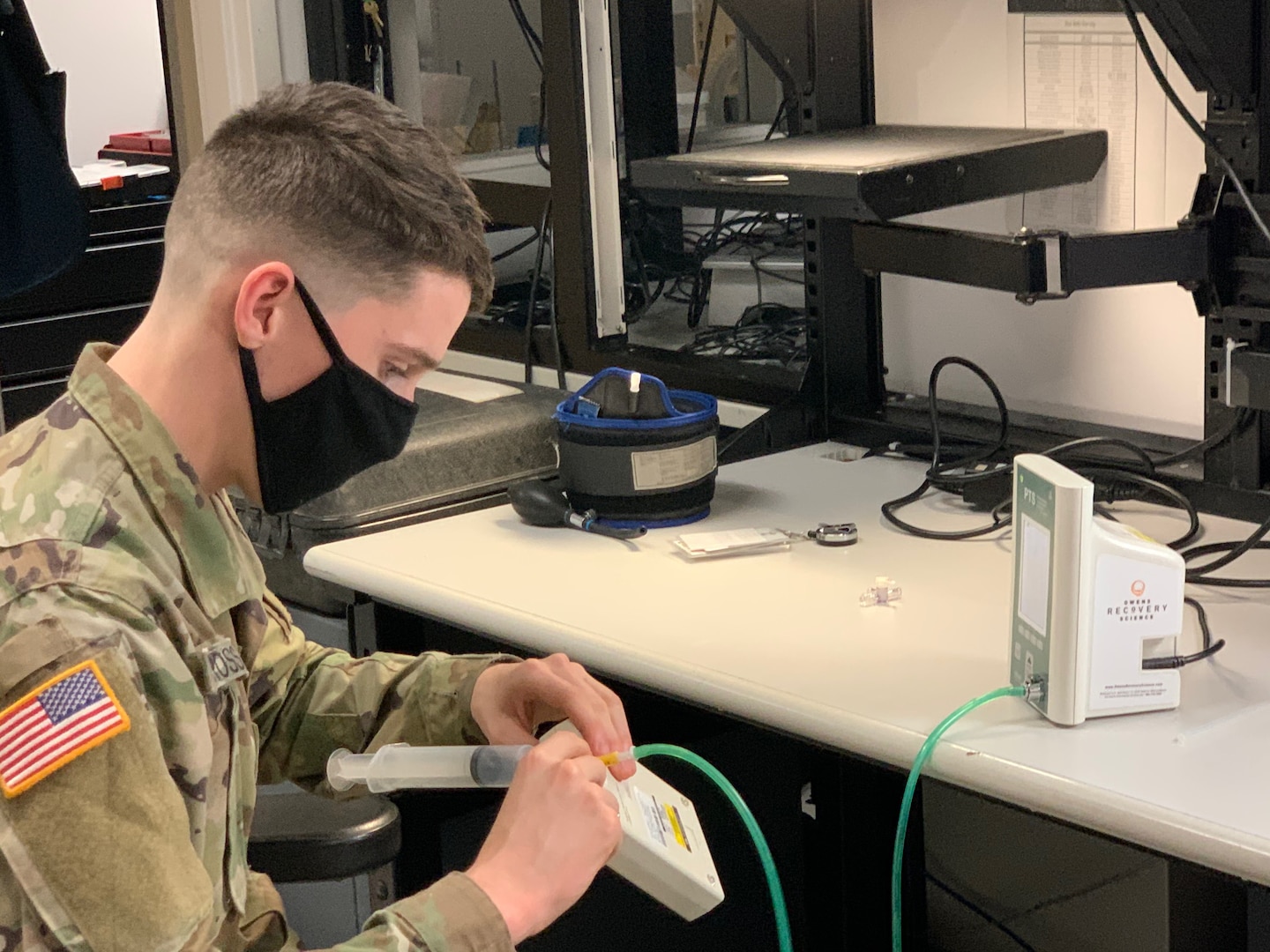 Pfc. Patrick Cross, biomedical electronics technician for Medical Department Activity – Alaska fixes a leak in a pneumatic tourniquet from the physical therapy department. Cross is part of a team that works to ensure medical equipment functions properly for safe patient care