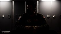 Airman sitting in shadows