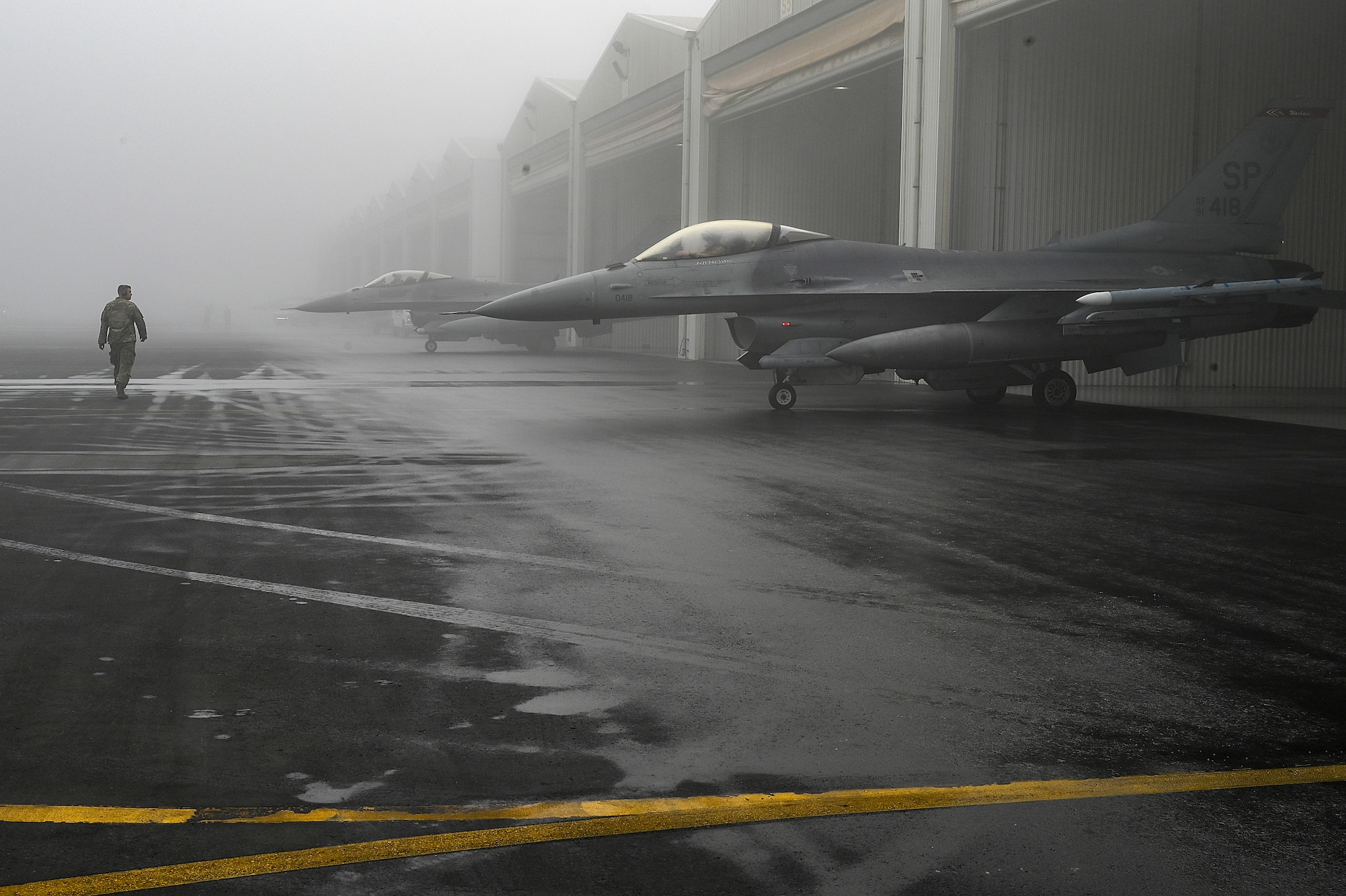 U.S Air Force F-16 Fighting Falcons assigned to the 480th Expeditionary Fighter Squadron prepare to taxi at Al Dhafra Air Base, United Arab Emirates, Jan. 19, 2021.