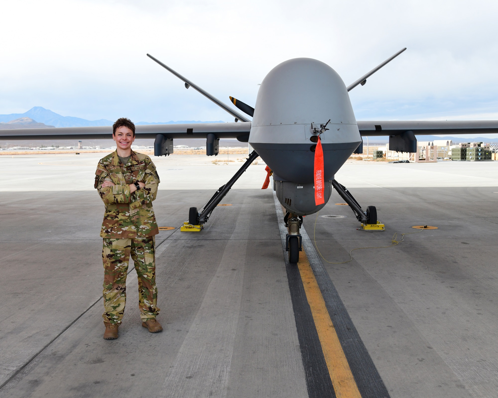 Master Sgt. Brittany, 91st Attack Squadron first sergeant, stands in front of MQ-9 Reaper, Jan. 22, Creech Air Force Base, Nevada. Brittany is one of the first enlisted aviators who have taken the step outside her career field to become a first sergeant, while still maintaining her flight hours and required qualifications.