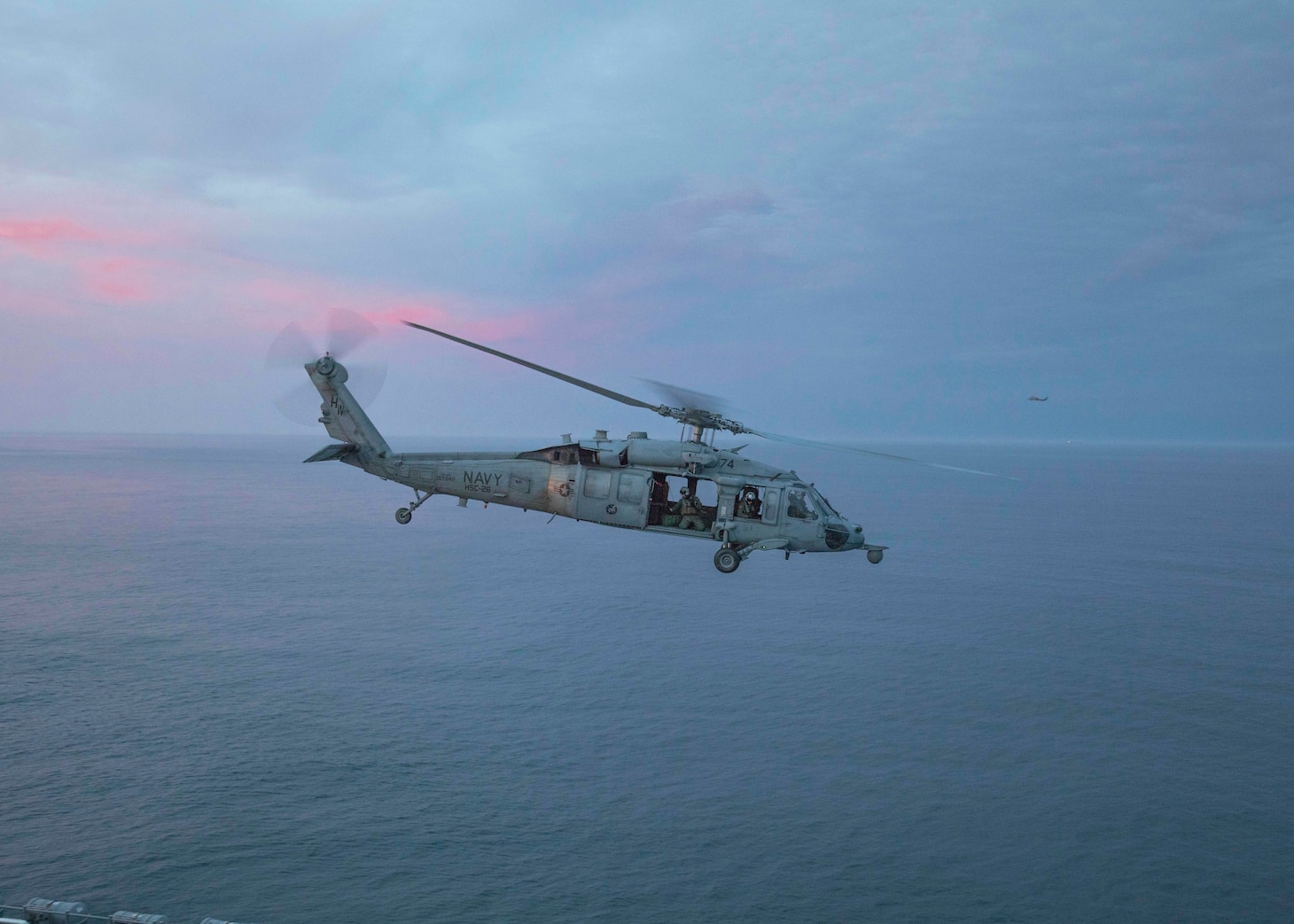 An MH-60S Sea Hawk, assigned to the Chargers, of Helicopter Sea Combat Squadron (HSC) 26, prepares to land on the flight deck aboard the amphibious assault ship USS Bataan (LHD 5).