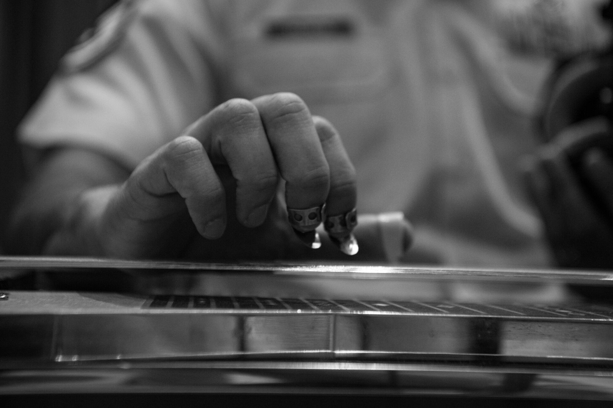 man plays steel guitar