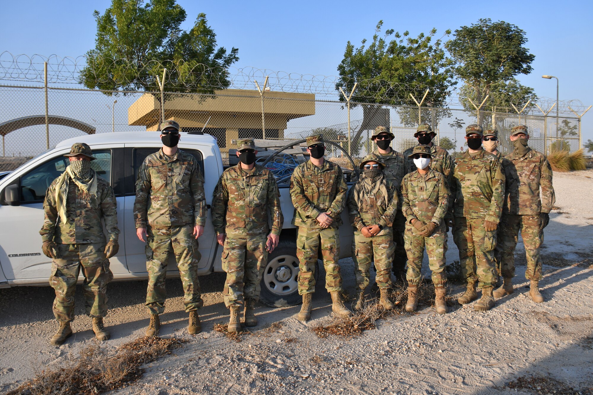 Team of Airmen with truck load of trash.