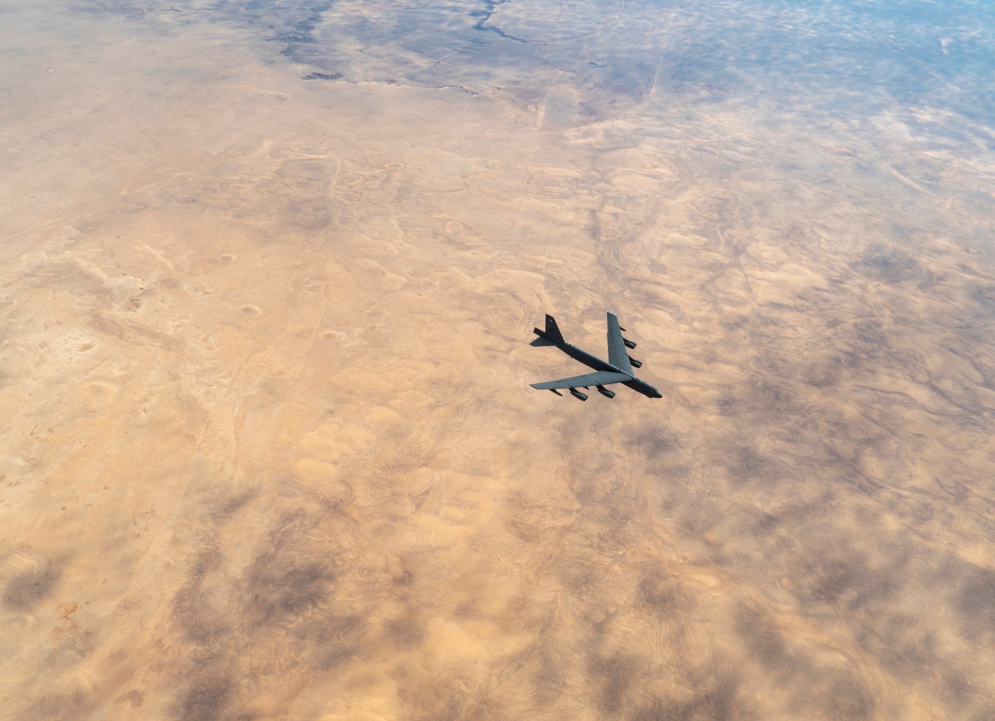 B-52 Stratofortress from Minot Air Force Base departs after aerial refueling by a U.S. Air Force KC-135 Stratotanker from the 28th Expeditionary Aerial Refueling squadron in the U.S. Central Command area of responsibility Jan. 17, 2021.
