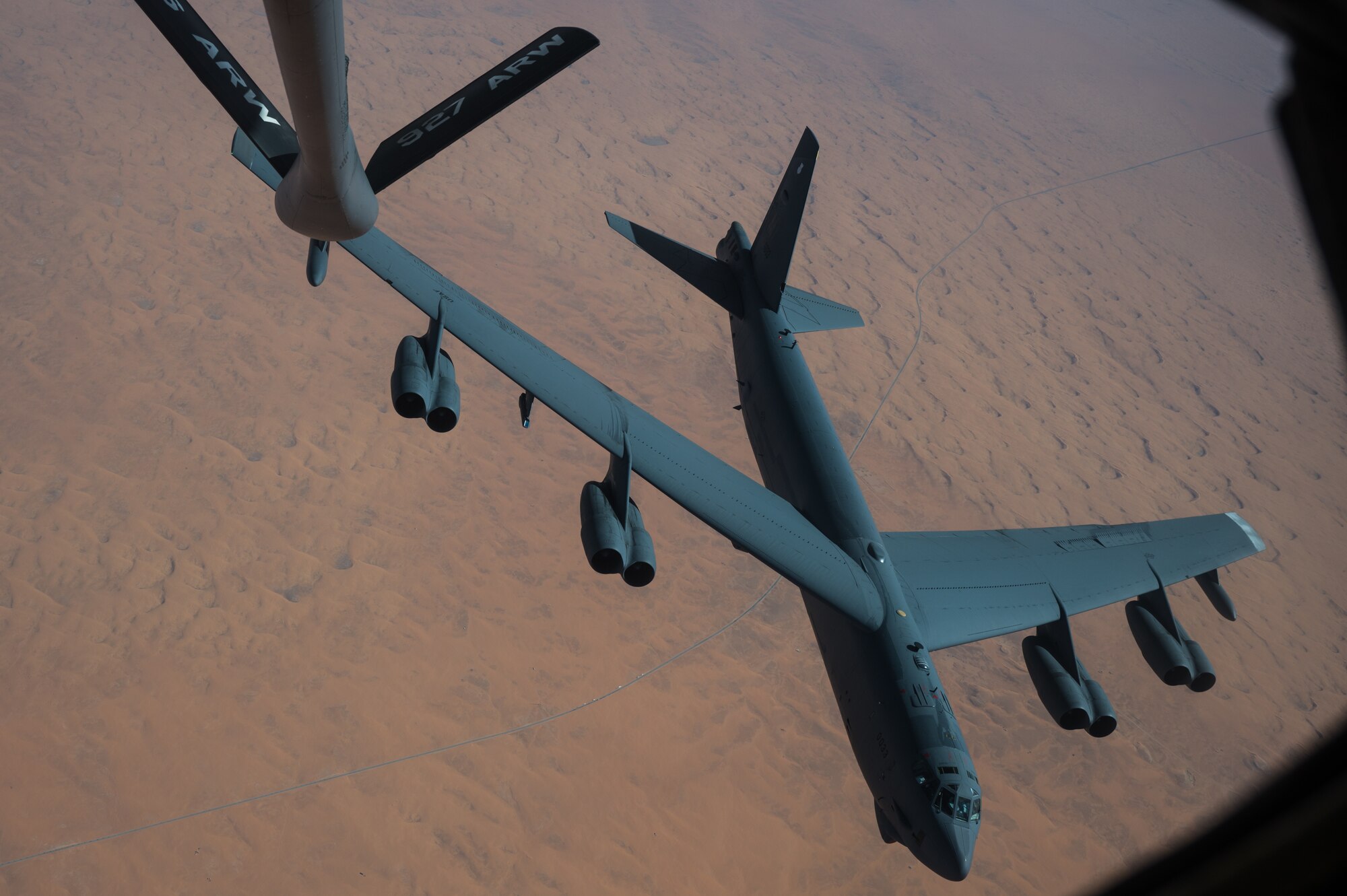 KC-135 Stratotanker refutes a B-52 Stratofortress during a bomber task force mission