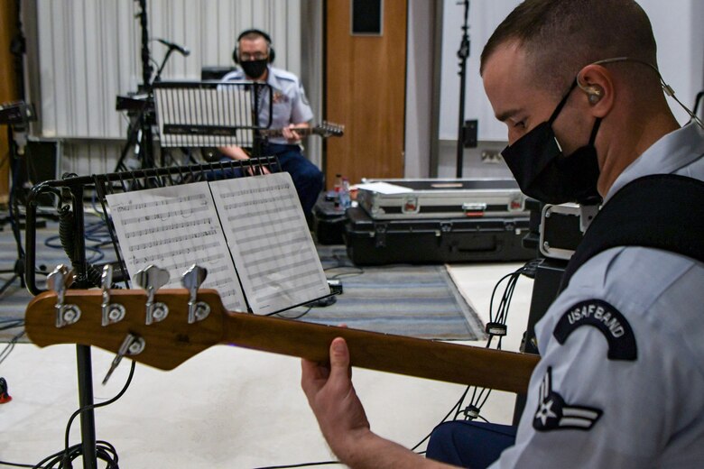 airmen play guitar in recording studio