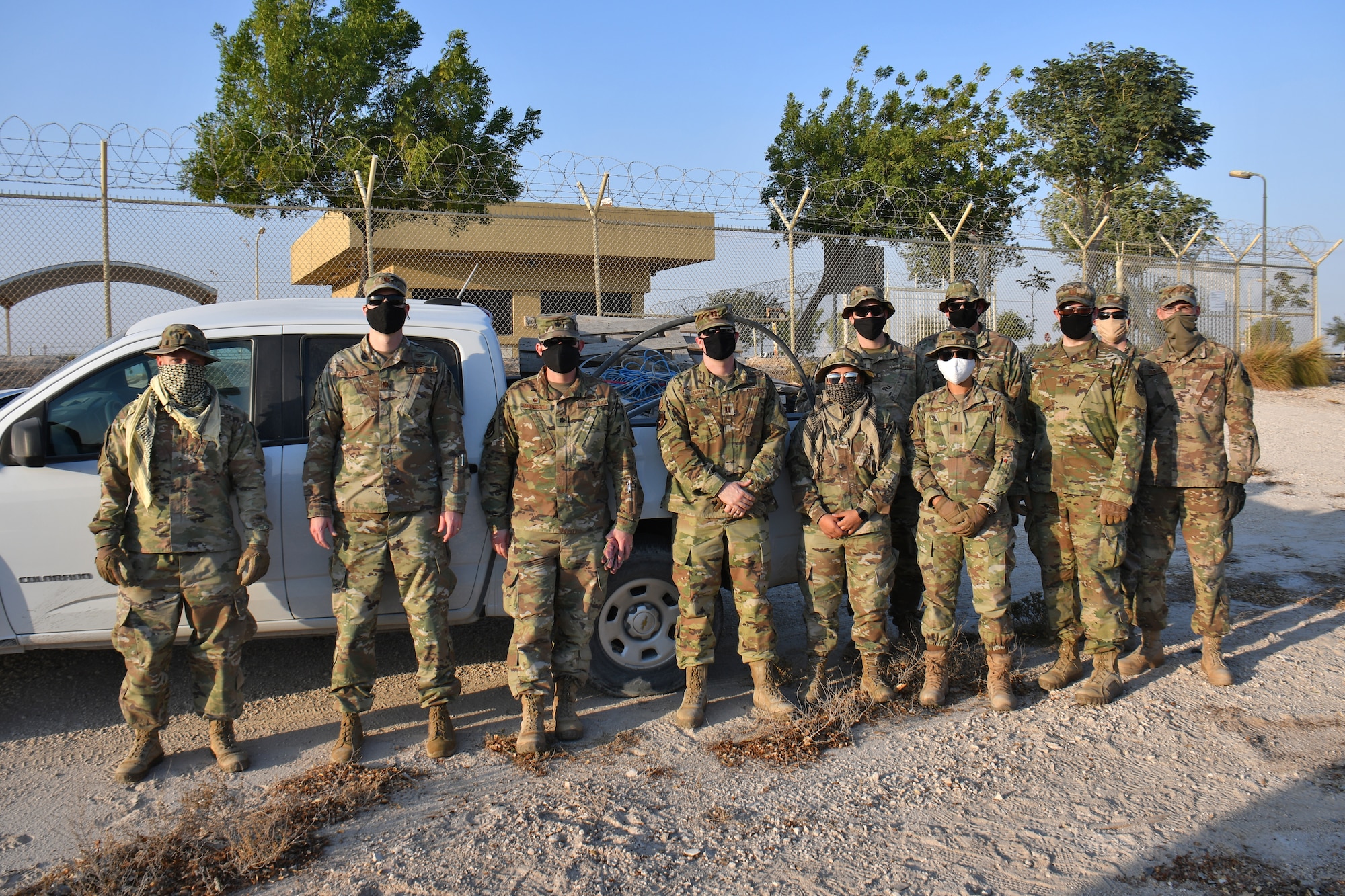 Team of Airmen with truck load of trash.