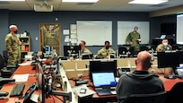 210122-N-PC620-0005 JOINT BASE LANGLEY-EUSTIS, Va. (Jan. 22, 2021) Army Capt. Darren Hamby, the Joint Task Force Civil Support (JTF-CS) Crisis Action Team (CAT) Chief, speaks to members of the CAT during Exercise Sudden Response 21.