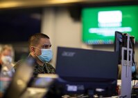 210124-N-PC620-0087 JOINT BASE LANGLEY-EUSTIS, Va. (Jan. 24, 2021) Marine Gunnery Sgt. Juan Morales, the non-commissioned officer in charge of the Joint Operations Center at Joint Task Force Civil Support coordinates simulated emergency response operations during Sudden Response 21.