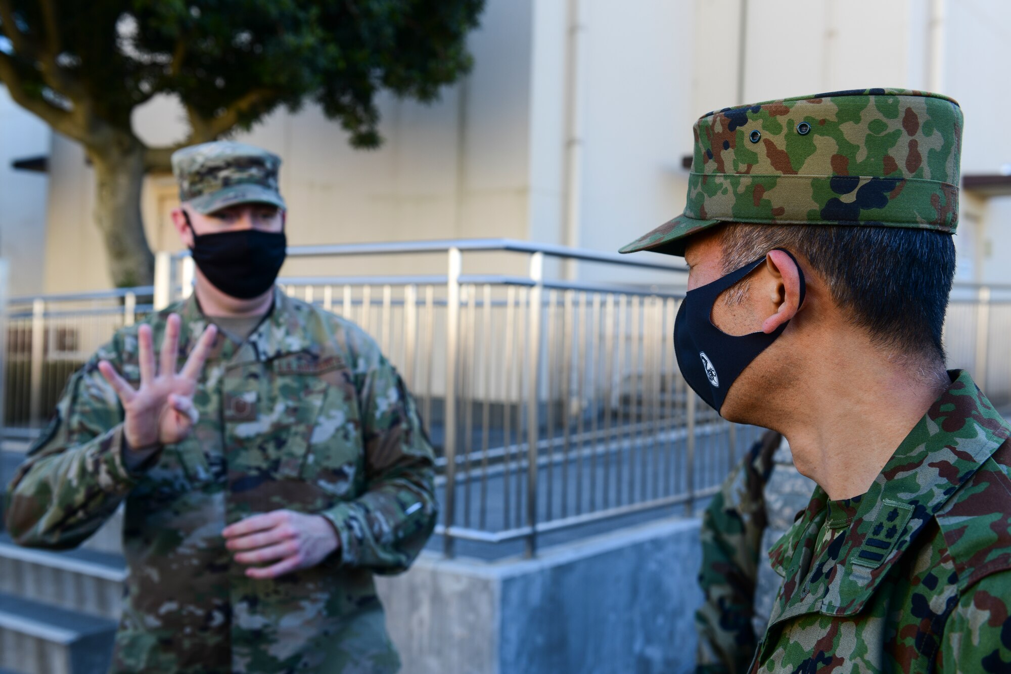 American Airman explains procedures to Japanese Soldier.