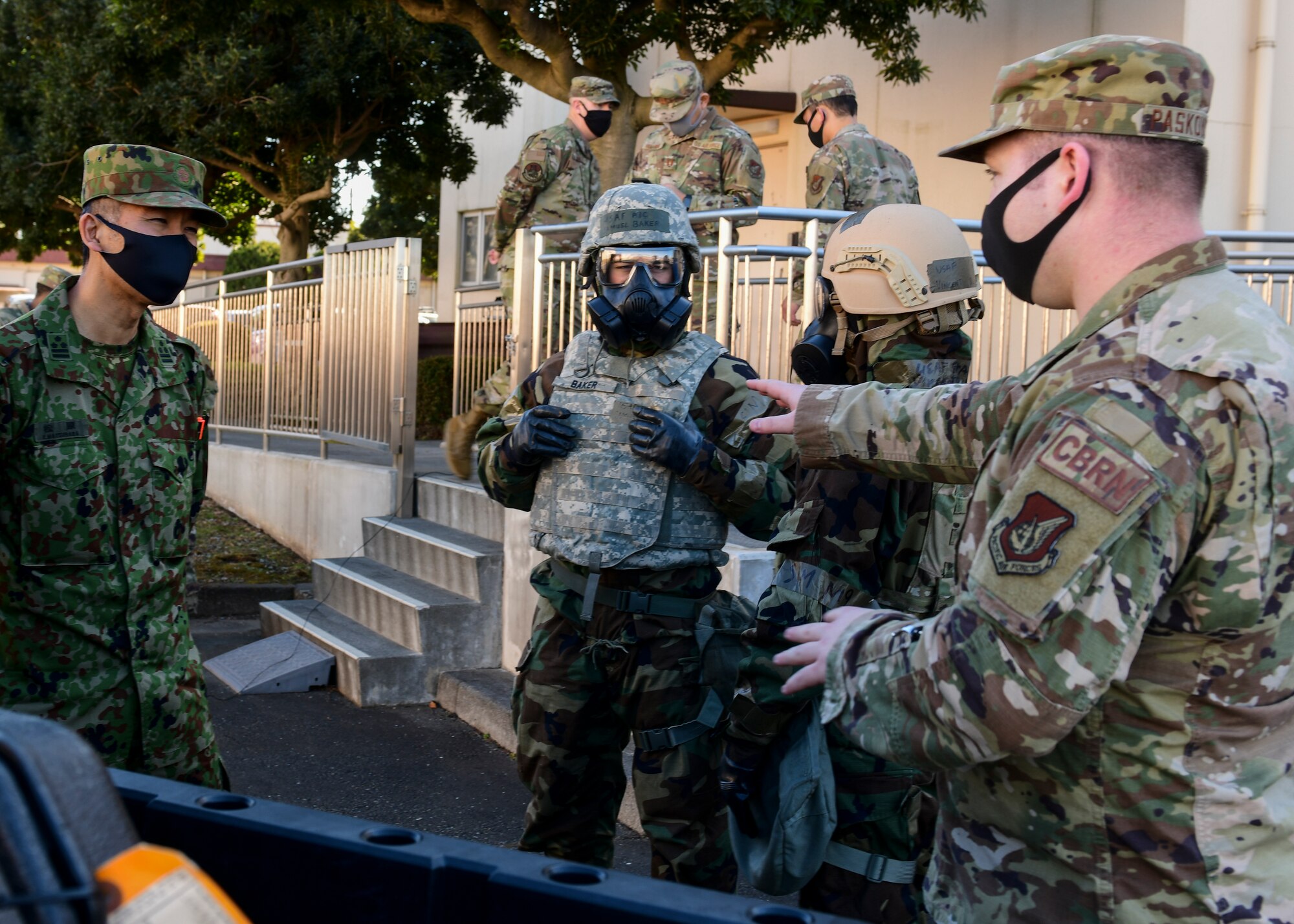 American Airman explains procedures to Japanese Soldier.