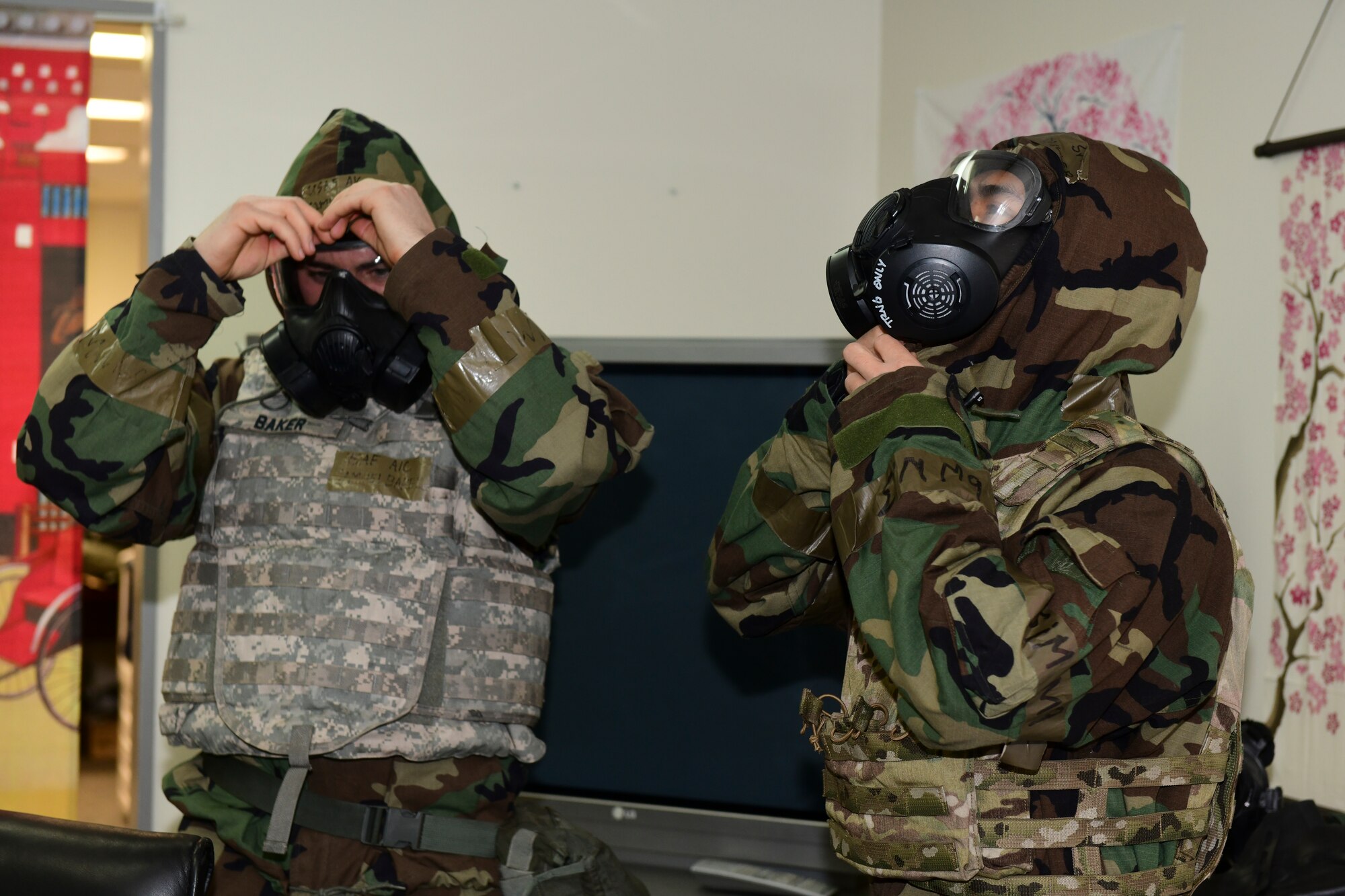 American Airman show how to properly put on protective gear.