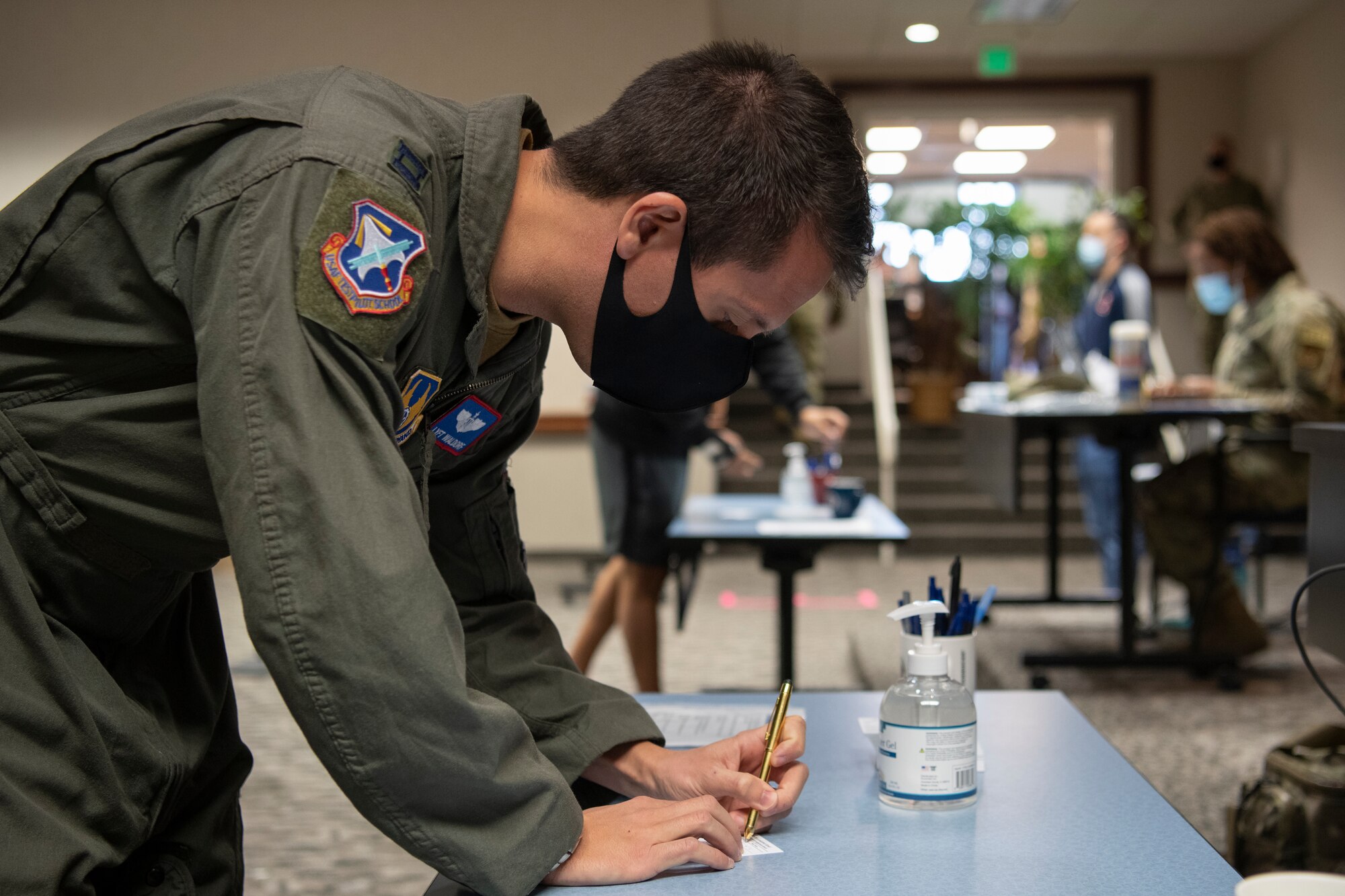 Test pilot school student prepares to receive COVID-19 Vaccine