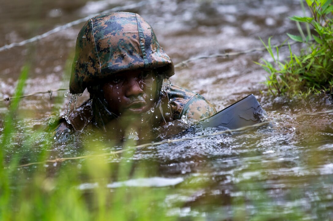 U.S. Marines with Officer Candidate School (OCS) celebrate the 50th anniversary of the “Quigley” training event at OCS on Marine Corps Base Quantico, Va., June 16, 2017. The Quigley is named after retired U.S. Marine Corps Lt. Col. William Quigley who designed the obstacle course based on his combat experience in Korea and Vietnam. (U.S. Marine Corps photo by Lance Cpl. Brian R. Domzalski)