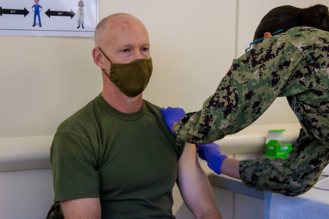 Maj. Gen. James F. Glynn, commander of Marine Forces, Special Operations Command, receives the COVID-19 vaccine at Naval Medical Center Camp Lejeune, Jan. 15, 2020. “The opportunity to protect yourself, your family, friends and our unit is here,” said Glynn. “I encourage all to get vaccinated to ensure you’re ready for every mission - regardless of time or place.” The COVID-19 vaccination plan is phase-driven and designed to safely protect members within the Department of Defense as quickly as possible. (U.S. Marine Corps photo taken by Cpl. Jesula Jeanlouis)