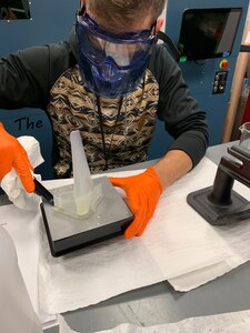 Adrian Wos, mechanical engineer for the Navy’s Mid-Atlantic Regional Maintenance Center (MARMC) and the Naval Acquisition Development Program (NADP), cleans and post-processes a 3D printer-made, model-scale propeller. Wos is one of two interns participating in NSWC PHD’s In-Service Engineering Agent collaboration with MARMC and NADP’s virtual internship program.