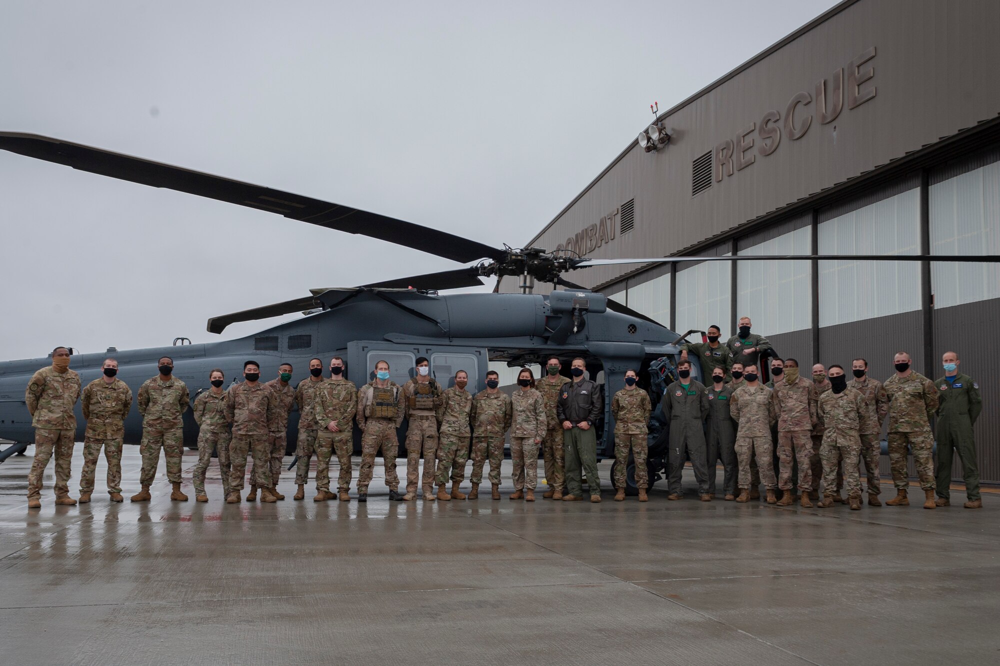 Photo of Chief Bass posing with Airmen