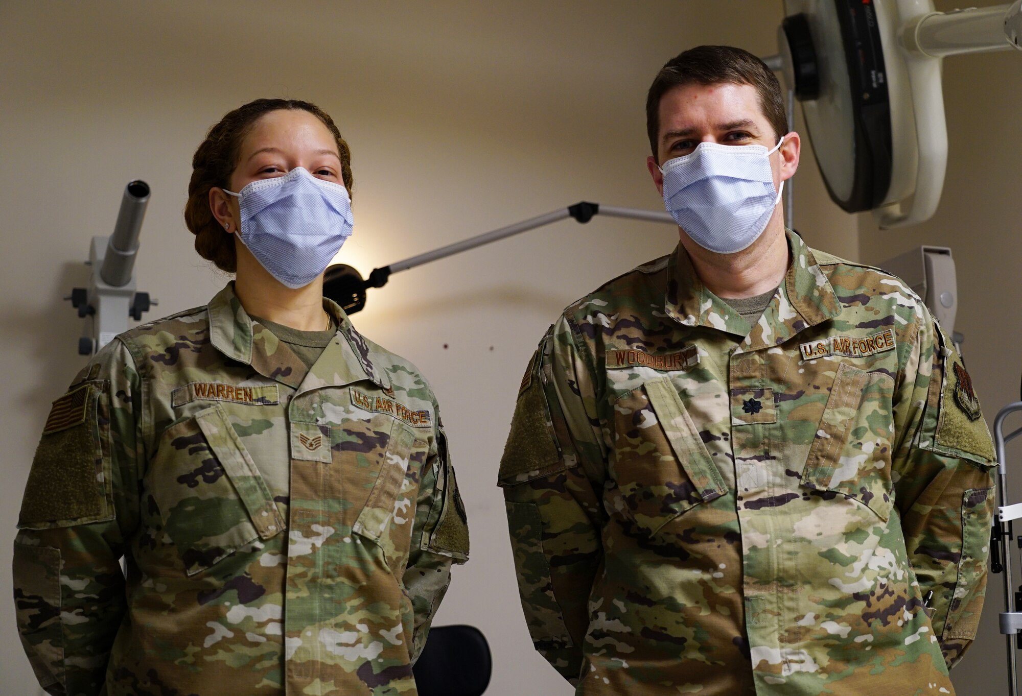 Staff Sgt. Kiara Warren, 319th Medical Operations Squadron optometry noncommissioned officer in charge, left, and Lt. Colonel Ethan Woodbury, 319 MDOS specialty care flight commander, stand for a photo in an examination room at Grand Forks Air Force Base, N.D., Jan. 21, 2021. The optometry office helps Airmen and their families receive eye care and maintain force readiness. (U.S. Air Force photo by Airman 1st Class Jack LeGrand)