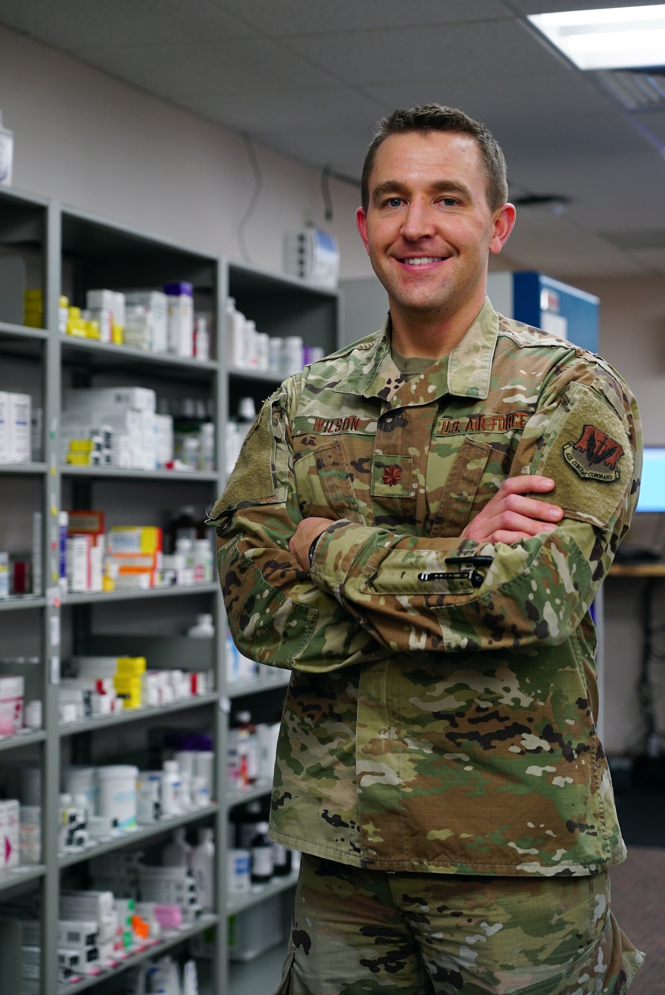 Maj. Burke Wilson, 319th Healthcare Operations Squadron diagnostics and therapeutics flight commander, stands  in the pharmacyat Grand Forks Air Force Base, N.D., Jan. 21, 2021. The pharmacy helps maintain mission readiness and makes sure Airmen and their families receive the proper medical treatment they require. (U.S. Air Force photo by Airman 1st Class Jack LeGrand)