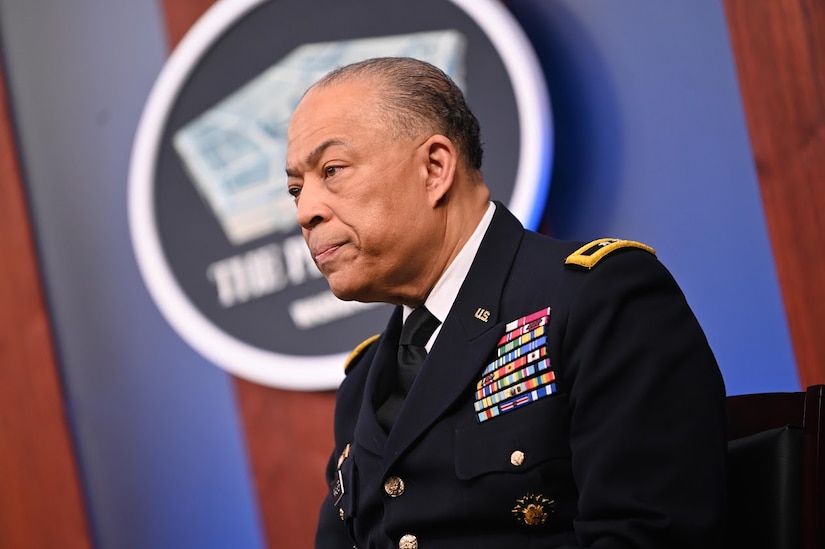A man in a military uniform is speaking. A sign behind him indicates that he is at the Pentagon.