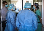 Lt. Gen. Laura J. Richardson, commanding general of U.S. Army North (Fifth Army) and the Joint Force Land Component Command, left, and Command Sgt. Maj. Phil K. Barretto, U.S. Army North and JFLCC senior enlisted leader, center, speak with 1st Lt. Elena Naumova, a critical care nurse with the 328th Urban Augmentation Medical Task Force, far right, during their visit to the Gallup Indian Medical Center, Gallup, New Mexico, Jan. 12, 2021.