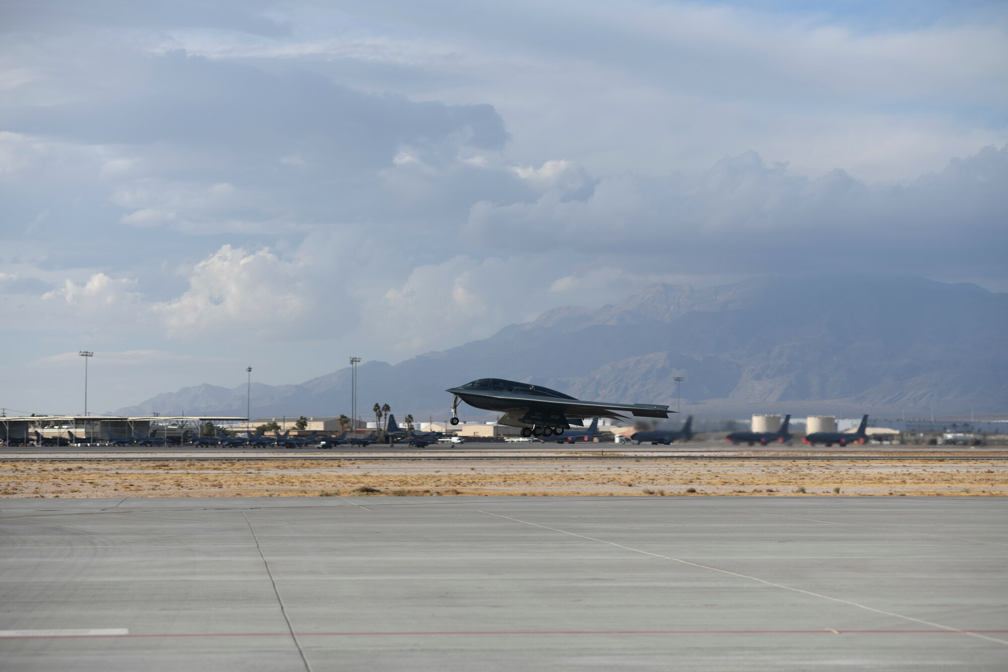A B-2 Spirit Stealth Bomber lands on the runway for Red Flag 21-1, at Nellis Air Force Base, Nevada, Jan. 22, 2021. Red Flag 21-1 is a large force exercise that is the U.S. Air Force's premier air-to-air combat training exercise and provides aircrews the experience of multiple, intensive air combat sorties in the safety of a training environment. (U.S. Air Force photo by Staff Sgt. Sadie Colbert)