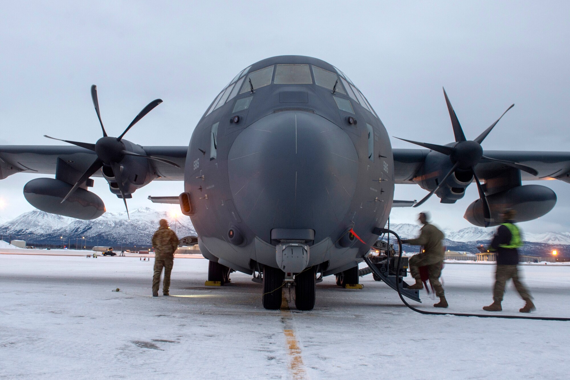 U.S. Airmen assigned to the 176th Maintenance Squadron, Alaska Air National Guard, check a HC-130J Combat King II prior to takeoff at Joint Base Elmendorf-Richardson, Alaska, Jan. 21, 2021, during Operation Noble Defender. Operation Noble Defender is a North American Aerospace Defense Command air-defense operation which allows dynamic training for operational readiness in an arctic environment.