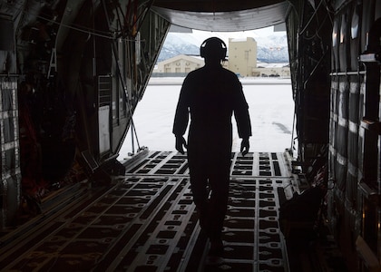 U.S. Air Force Tech. Sgt. Eric Dickerson, a loadmaster assigned to the 211th Rescue Squadron, Alaska Air National Guard, conducts a preflight check on a HC-130J Combat King II at Joint Base Elmendorf-Richardson, Alaska, Jan. 21, 2021, during Operation Noble Defender. Operation Noble Defender is a North American Aerospace Defense Command air-defense operation which allows dynamic training for operational readiness in an arctic environment.